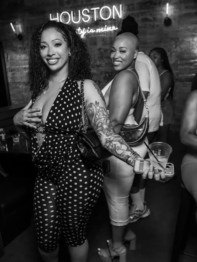 Two guests photographed in black and white