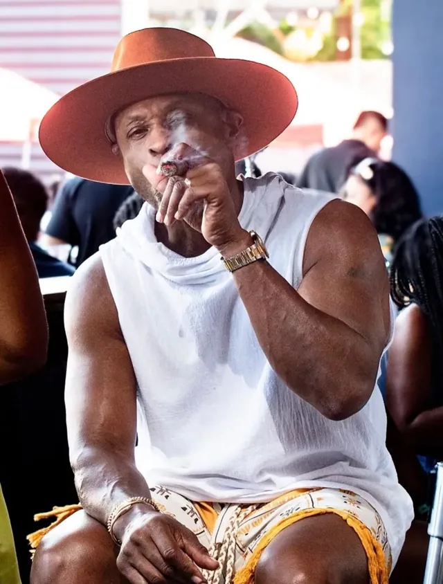 Guest wearing a wide-brimmed hat on the patio
