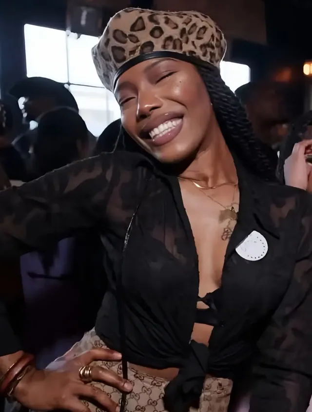Smiling guest in a leopard beret at Chapman Sundays, Chapman & Kirby, EaDo Houston
