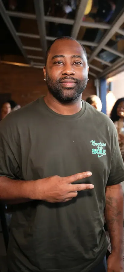 Guest in an olive-colored shirt