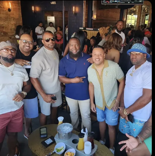 Group gathered around a table inside the venue